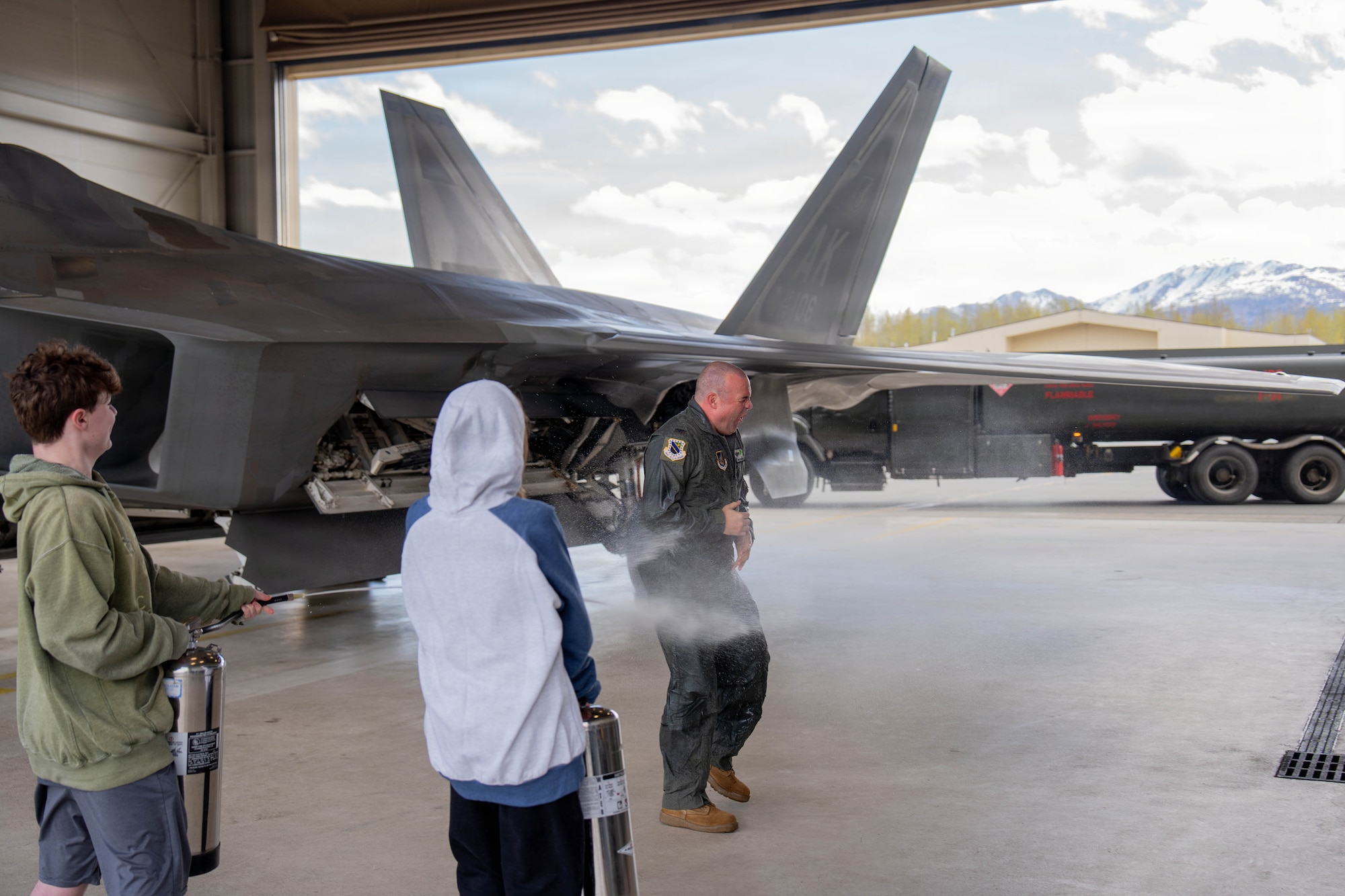 U.S. Air Force Col. Charles Schuck, 3rd Wing commander, participates in a traditional fini-flight celebration following his final flight on Joint Base Elmendorf-Richardson, Alaska, May 26, 2026. The fini-flight is a longstanding tradition where a pilot is honored for their time flying an aircraft. (U.S. Air Force photo by Airman 1st Class Keola Vischi)