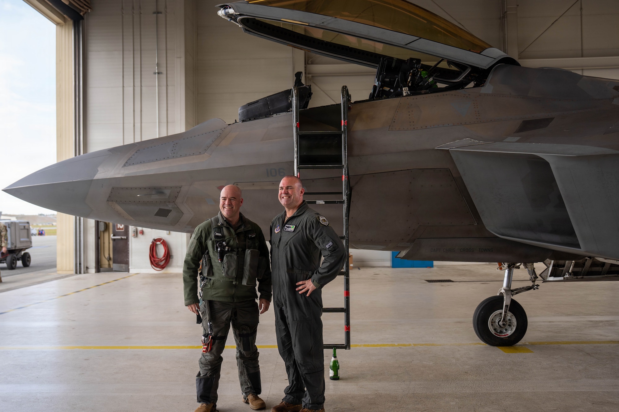 U.S. Air Force Col. Charles Schuck, 3rd Wing commander, right, poses with Col. Andrew Stolee, 3rd Operations Group commander in front of an F-22 Raptor aircraft following Schuck's fini-flight on Joint Base Elmendorf-Richardson, Alaska, May, 26, 2026. The event marked Schuck's final flight with the 3rd Wing ahead of his upcoming permanent change of station. (U.S. Air Force photo by Airman 1st Class Keola Vischi)