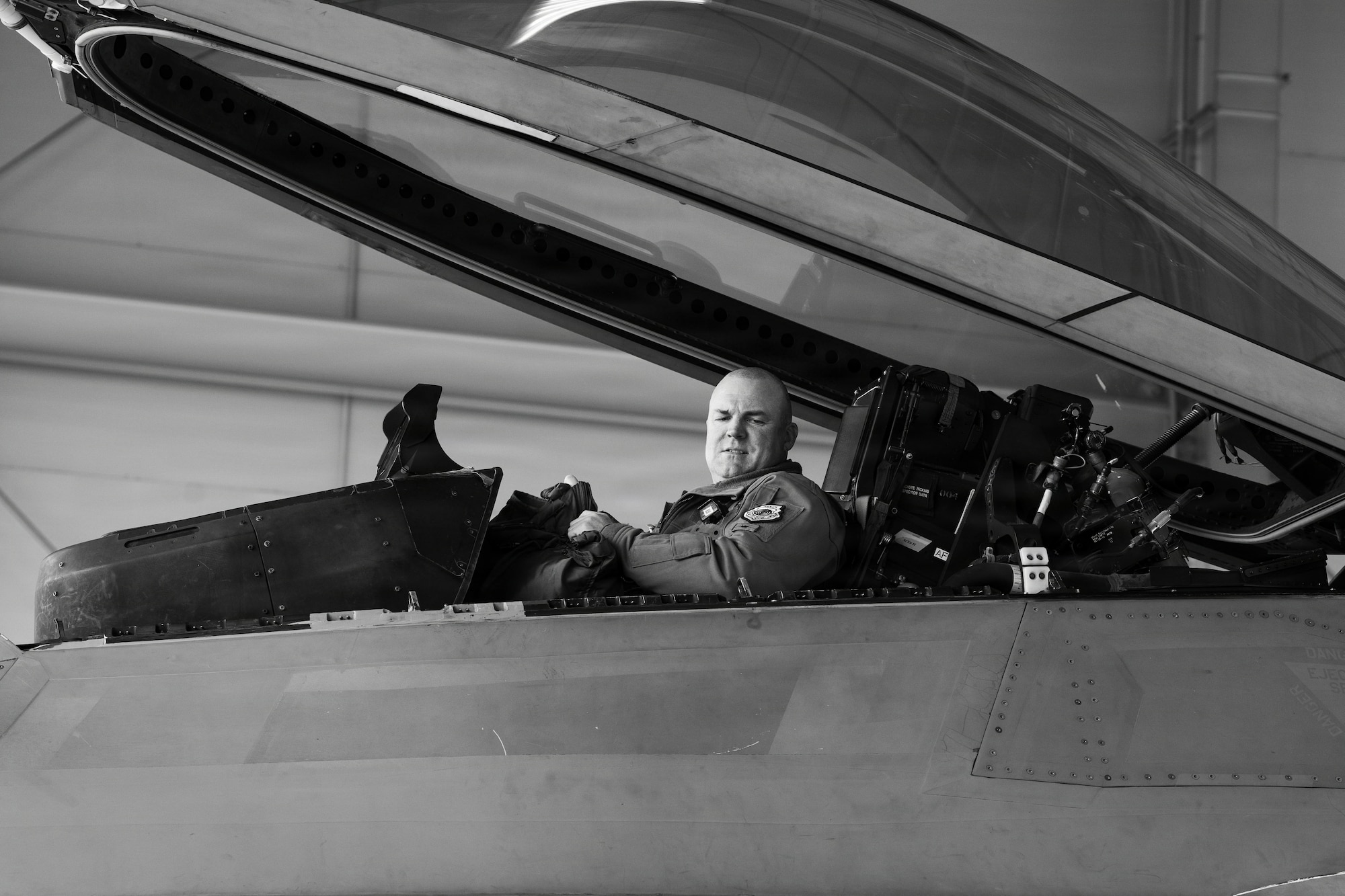 U.S. Air Force Col. Charles Schuck, 3rd Wing commander, sits in the cockpit of an F-22 Raptor aircraft after his final flight on Joint Base Elmendorf-Richardson, Alaska, May 26, 2026. Schuck has served as the 3rd Wing commander for two years, leading over 2,200 assigned Airmen. (U.S. Air Force photo illustration by Airman 1st Class Keola Vischi)