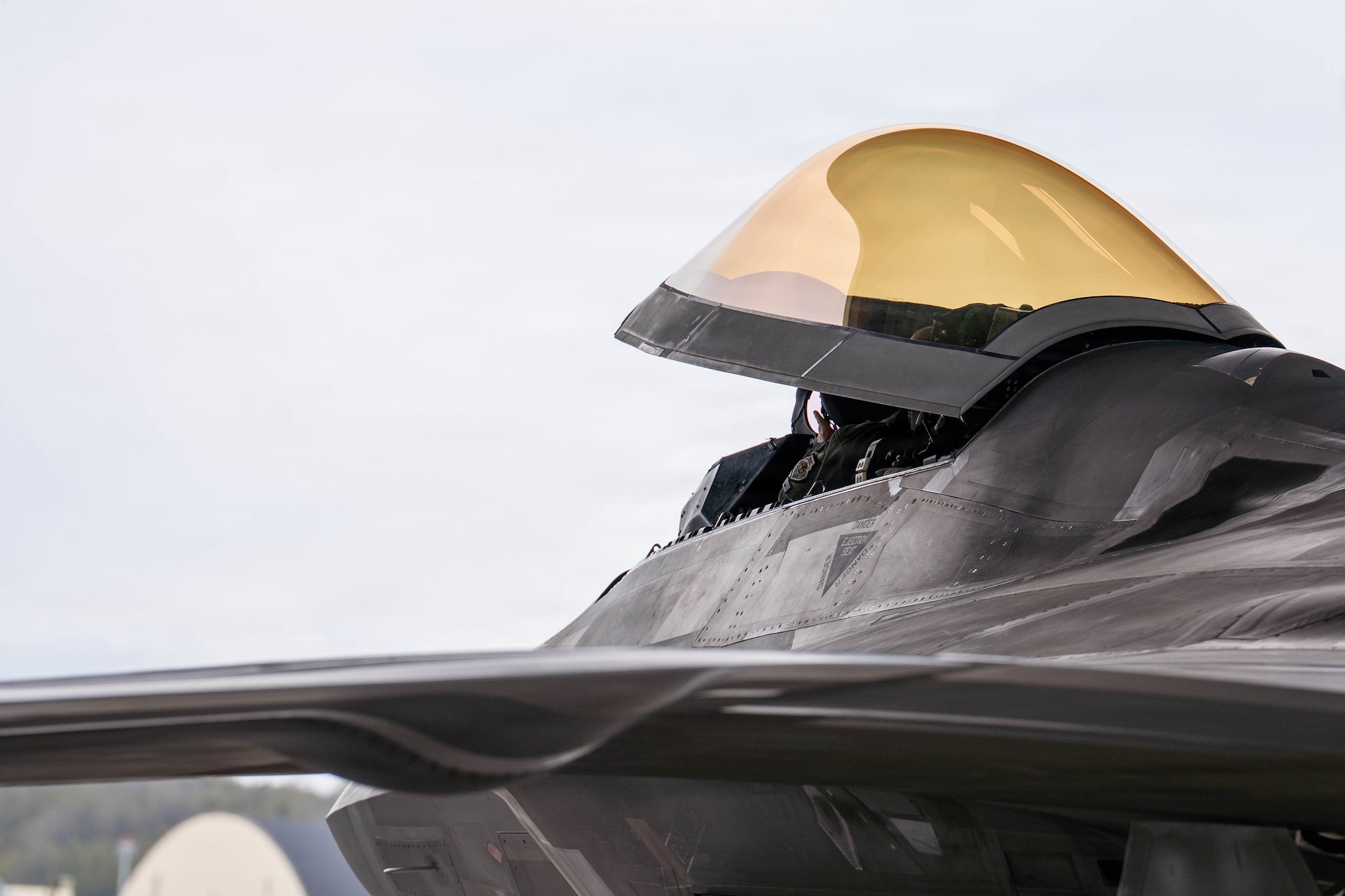 U.S. Air Force Col. Charles Schuck, 3rd Wing commander, taxies an F-22 Raptor after his final flight on Joint Base Elmendorf-Richardson, Alaska, May 26, 2026. The fini-flight is an Air Force tradition celebrating a pilot's career and achievements prior to a permanent change of station or retirement. (U.S. Air Force photo by Airman 1st Class Keola Vischi)