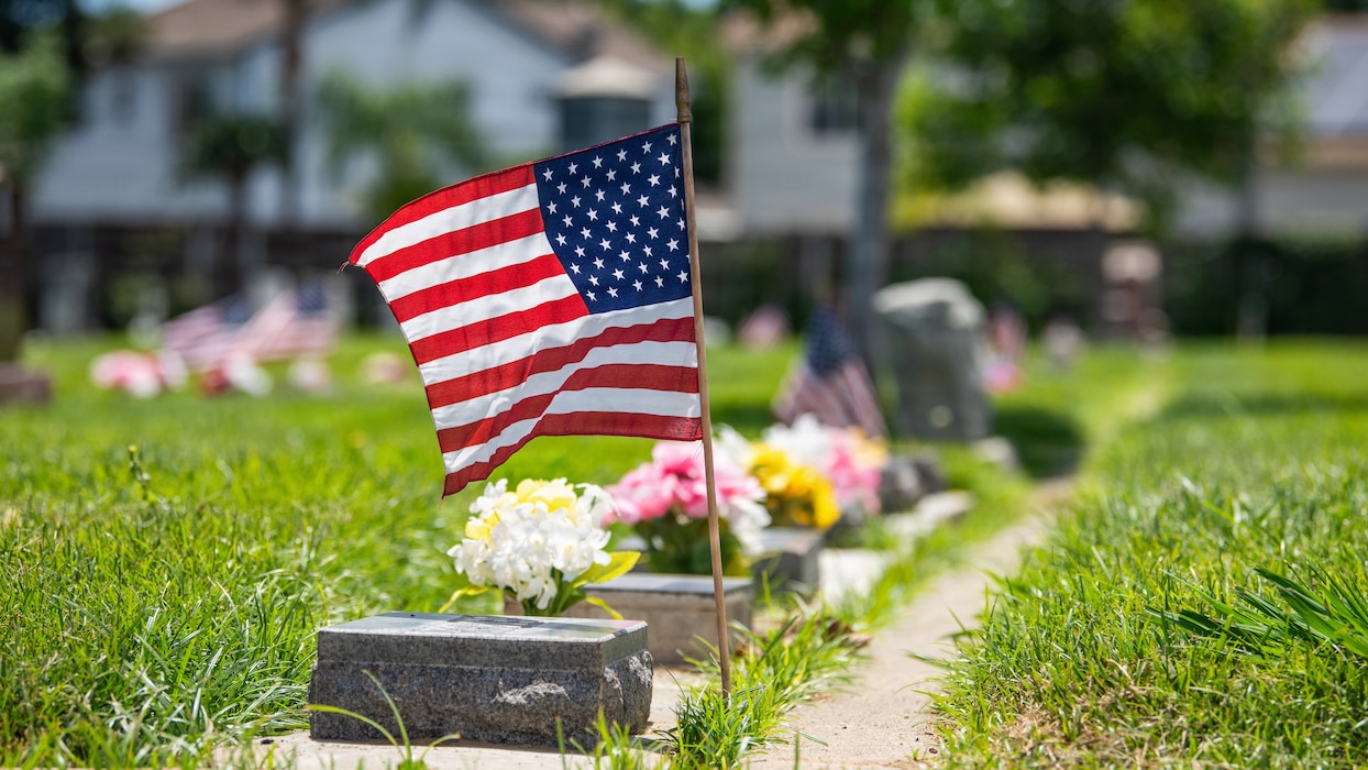 Close up of an American flag at a gravesite