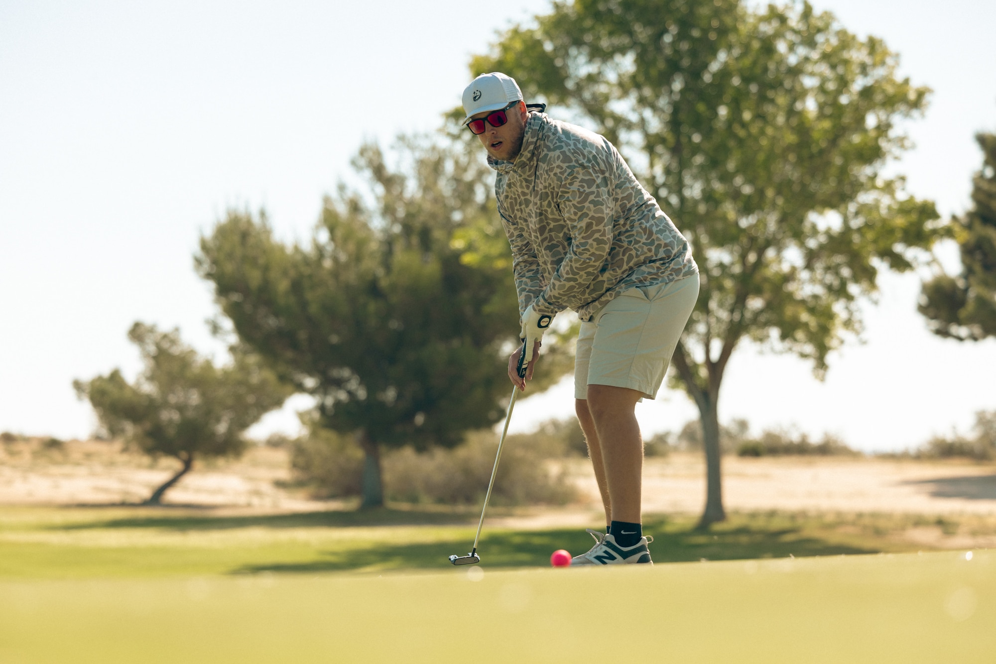 Staff Sgt. Bryce Souders, 412th Security Forces, Detachment 1, Air Force Operating Location Plant 42, hits a putt during a the Police Week 2026 Golf Tournament at Edwards Air Force Base, California, May 13, 2026. (Air Force photo by Brandon Hernandez)