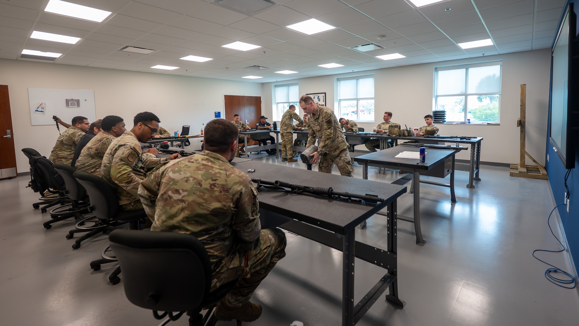 U.S. Air Force personnel assigned to the 325th Security Forces Squadron assemble M870 shotguns during a qualification course at Tyndall Air Force Base, Florida, May 21, 2026. The two-part training program ensured security forces personnel understood the theory of engaging moving targets in the classroom before executing those techniques on the range. (U.S. Air Force photo by Airman 1st Class Rosario Garcia)