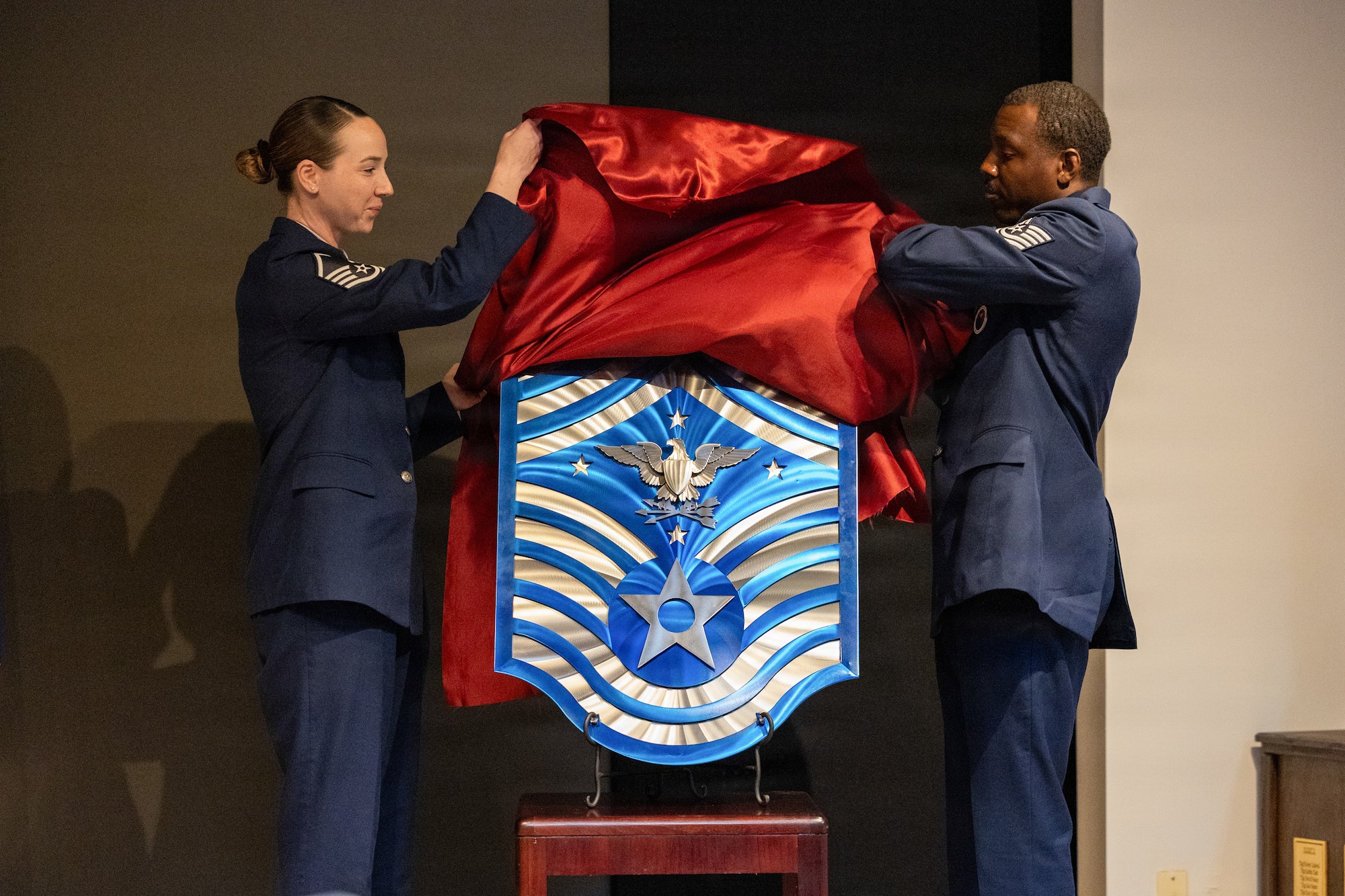 The rank insignia for the U.S. Air Force Senior Enlisted Advisor to the Chairman is unveiled during the dedication of the Colón‑López Noncommissioned Officer Academy Auditorium at Sheppard Air Force Base, Texas, May 27, 2026
