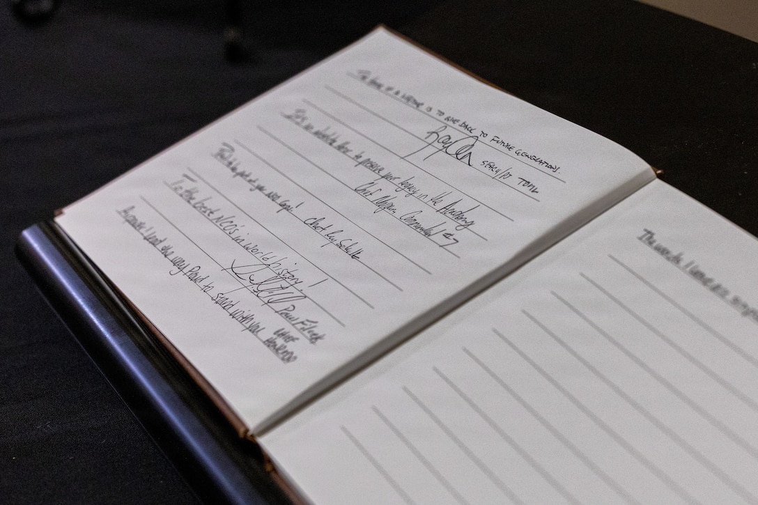 A guest book sits open for visitors to sign outside the Colón‑López Noncommissioned Officer Academy Auditorium at Sheppard Air Force Base, Texas, May 27, 2026.