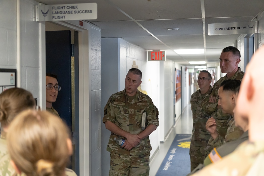 Chief Master Sgt. Tyler Smith, intelligence career field manager (center), listens to a brief from MSgt Cameron Kline, Language Success Flight Chief at the 314th Training Squadron, Presidio of Monterey, May 12, 2026.