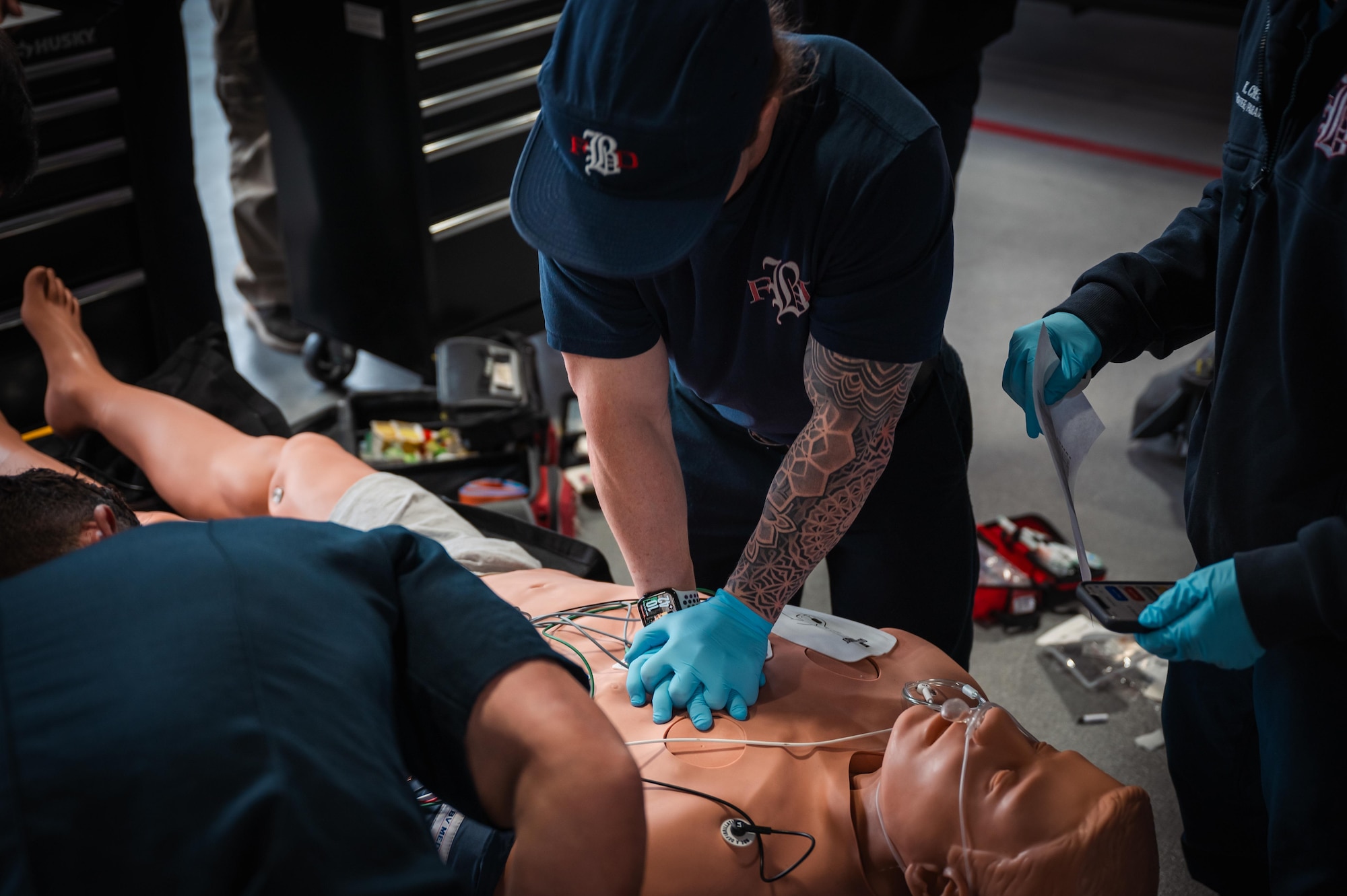 Paramedics with Buckley Fire and Emergency Services perform CPR on a trauma mannequin