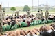 Student-athletes from high schools around Central Texas complete sit-ups while arms are interlocked with the people next to them during the Basic Training Challenge at the U.S. Army Experience March 25, 2026, at Fort Hood, Texas.