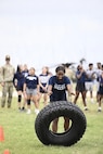 Kristeyan McNair, 15, a sophomore at Shoemaker High School in Killeen, Texas, flips a tire during the Basic Training Challenge at the U.S. Army Experience March 25, 2026, at Fort Hood, Texas.