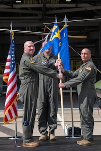 U.S. Air Force Maj. Christopher Boise, right, incoming commander of the 582nd Operations Support Squadron Detachment 4, gives his first salute to Lt. Col. Matthew Walker, 582 OSS commander, left, during a change of command ceremony at Malmstrom AFB, Mont.