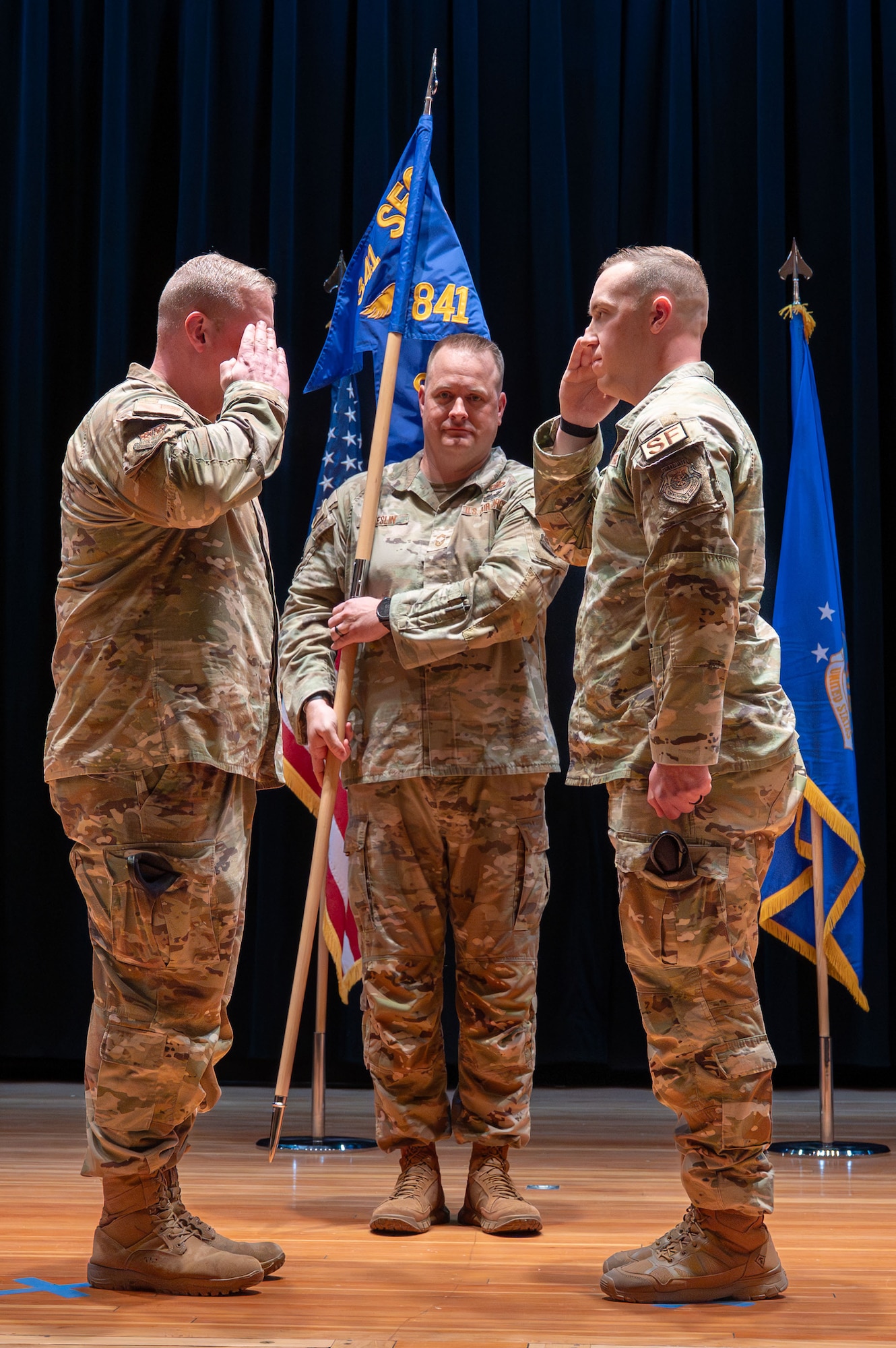 U.S. Air Force Capt. Colin Hoveln, right, incoming commander of the 841st Missile Security Forces Squadron, gives his first salute to Col. Drew Gehler, 341st Security Forces Group commander, during a change of command ceremony at Malmstrom AFB, Montana.