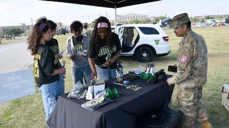 Students Speak to Army Recruiter at the U.S. Army Experience