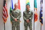 NAVAL AIR STATION SIGONELLA, Italy (May 14, 2026) Cmdr. Micah Kinney, executive officer of Naval Medical Research Unit (NAMRU) EURAFCENT, and Hospital Corpsman 1st Class Kirk Ashley Young, biomedical equipment technician, both routinely practice within Navy Medicine Readiness and Training Command (NMRTC) Sigonella. NAMRU EURAFCENT, part of Navy Medicine Research & Development, conducts research, surveillance and studies of vaccines, therapeutic agents, diagnostic assays and vector control measures in the EUCOM, AFRICOM and CENTCOM Areas of Responsibility to better prevent and treat infectious diseases in support of Navy, Marine Corps and joint U.S. warfighter health, readiness and lethality. (U.S. Navy photo by Tiziana Consoli/Released)
