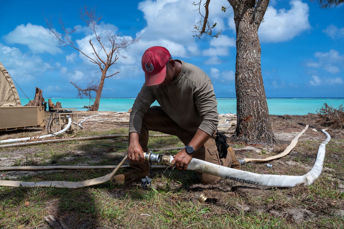 U.S. Air Force Senior Airman Joshua Malong, a heating, ventilation, and air conditioning refrigeration journeyman assigned to the 554th Rapid Engineer Deployable Heavy Operations Repair Squadron Engineers, locks water pipes for a Reverse Osmosis Water Purification Unit (ROWPU) at Pao Pao Beach, Saipan, Commonwealth of the Northern Mariana Islands, April 28, 2026. ROWPU was deployed in support of bringing usable water to Saipan residents through a series of filtration processes. All support efforts are conducted in close coordination with local, territorial, and federal partners to ensure a unified and efficient response to Typhoon Sinlaku disaster relief. (U.S. Air Force photo by Senior Airman Manasseh Demissie)