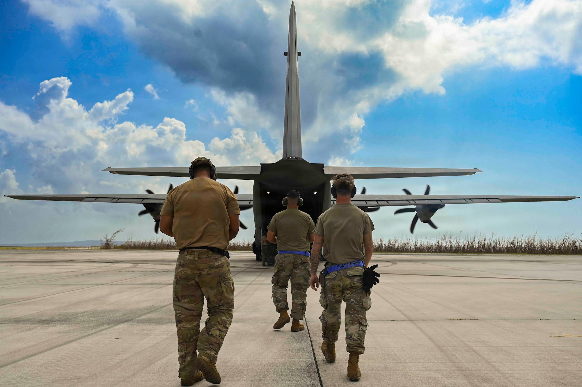 U.S. Airmen assigned to the 36th Contingency Response Squadron approach a C-130J Hercules containing supplies on the flightline at Saipan International Airport, Saipan, Northern Marianas Islands, April 19, 2026. Joint military members from across U.S. Indo-Pacific Command are dedicated to providing recovery based efforts in wake of Super Typhoon Sinlaku. (U.S. Air Force photo by Senior Airman Joseph Maye)