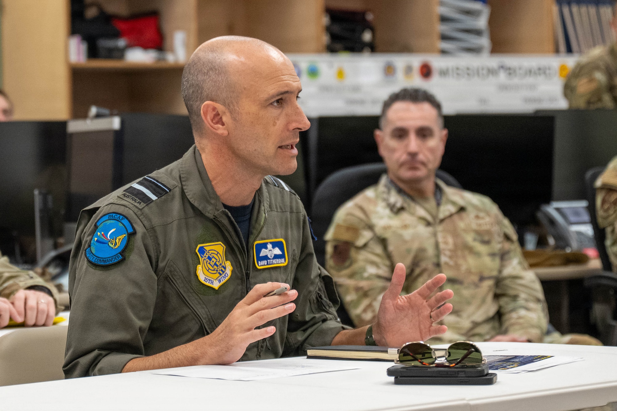 Royal Australian Air Force Air Vice-Marshal David Titheridge, Pacific Air Forces deputy commander, speaks at Joint Base Pearl Harbor-Hickam, May 19, 2026. Titheridge and the 15th Wing team discussed collaborative maintenance efforts between the United States and partner nations in times of operational necessity. (U.S. Air Force photo by Senior Airman Lauren Torres)