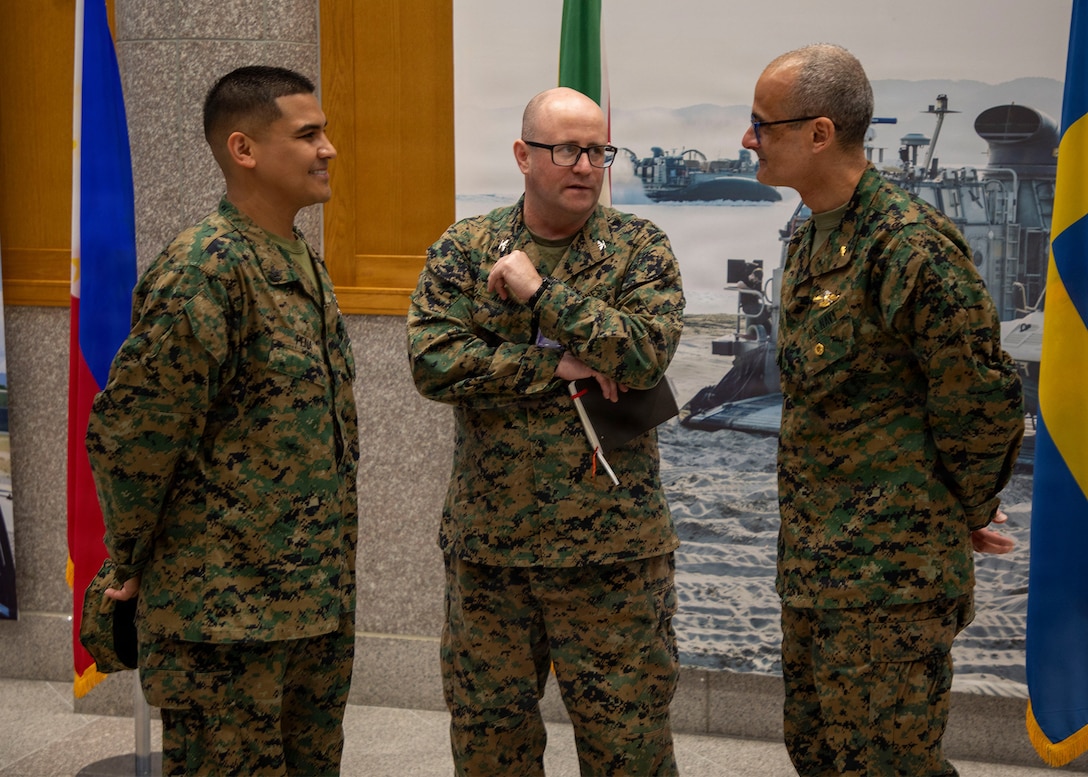 Rear Adm. Guido Valdez speaks with Marines and Sailors during a visit to U.S. Army Garrison Camp Humphreys.