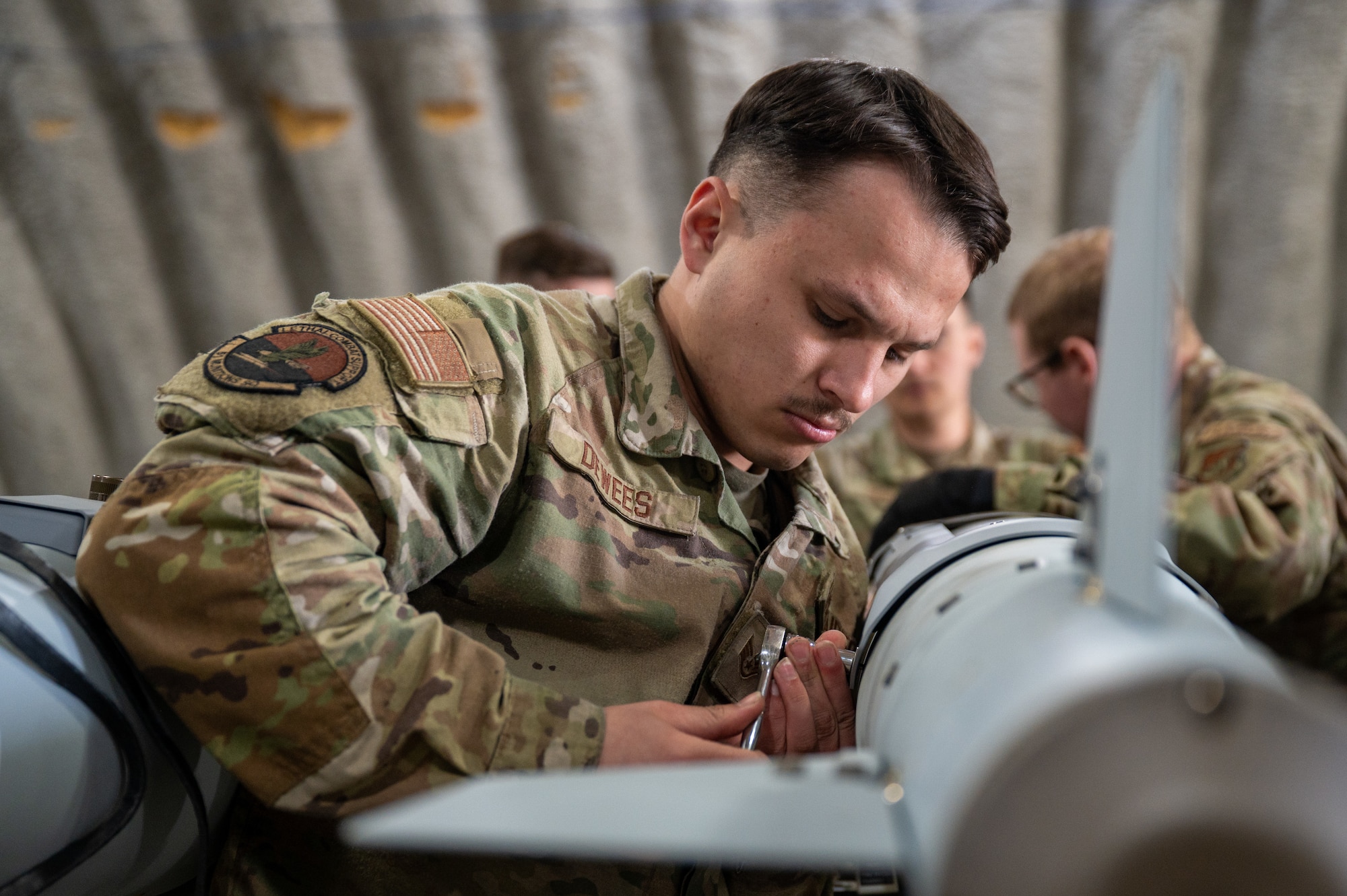 U.S. Air Force Staff Sgt. Matthew Dewees, 51st Munitions Squadron conventional maintenance crew member, prepares inert munitions for Distant Frontier on Eielson Air Force Base, Alaska, May 18, 2026. Distant Frontier, a unit-level training exercise, provides units an opportunity before and after RED FLAG-Alaska to train in the Joint Pacific Alaska Range Complex (JPARC) and exchange tactics, techniques and procedures to sharpen their combat readiness. (U.S. Air Force photo by Airman First Class Lara Jhane Rabago)