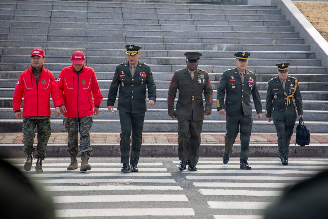 Brig. Gen. Kim Soo Young and Sgt. Maj. Ismael G. Bamba arrive for a graduation ceremony at ROK Marine Corps Base Pohang.