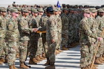 Military instructor congratulates trainee