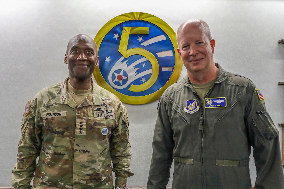 U.S. Army Gen. Xavier T. Brunson, commander of USFK, poses with Air Force Lt. Gen. Joel Carey, commander of 5th Air Force, to discuss operational planning at Yokota Air Base, Japan.