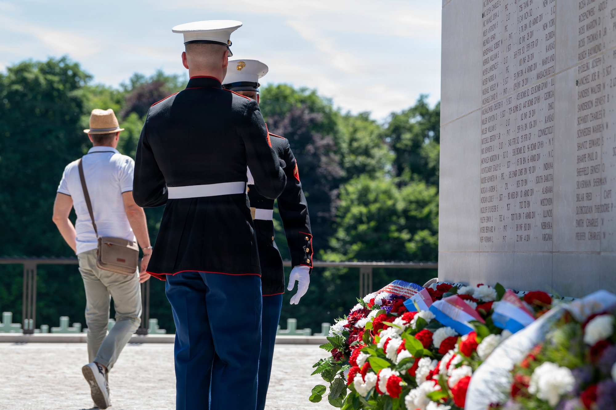 A photo of two Marines holding a wreath during a Memorial Day ceremony at Luxembourg American Cemetery.