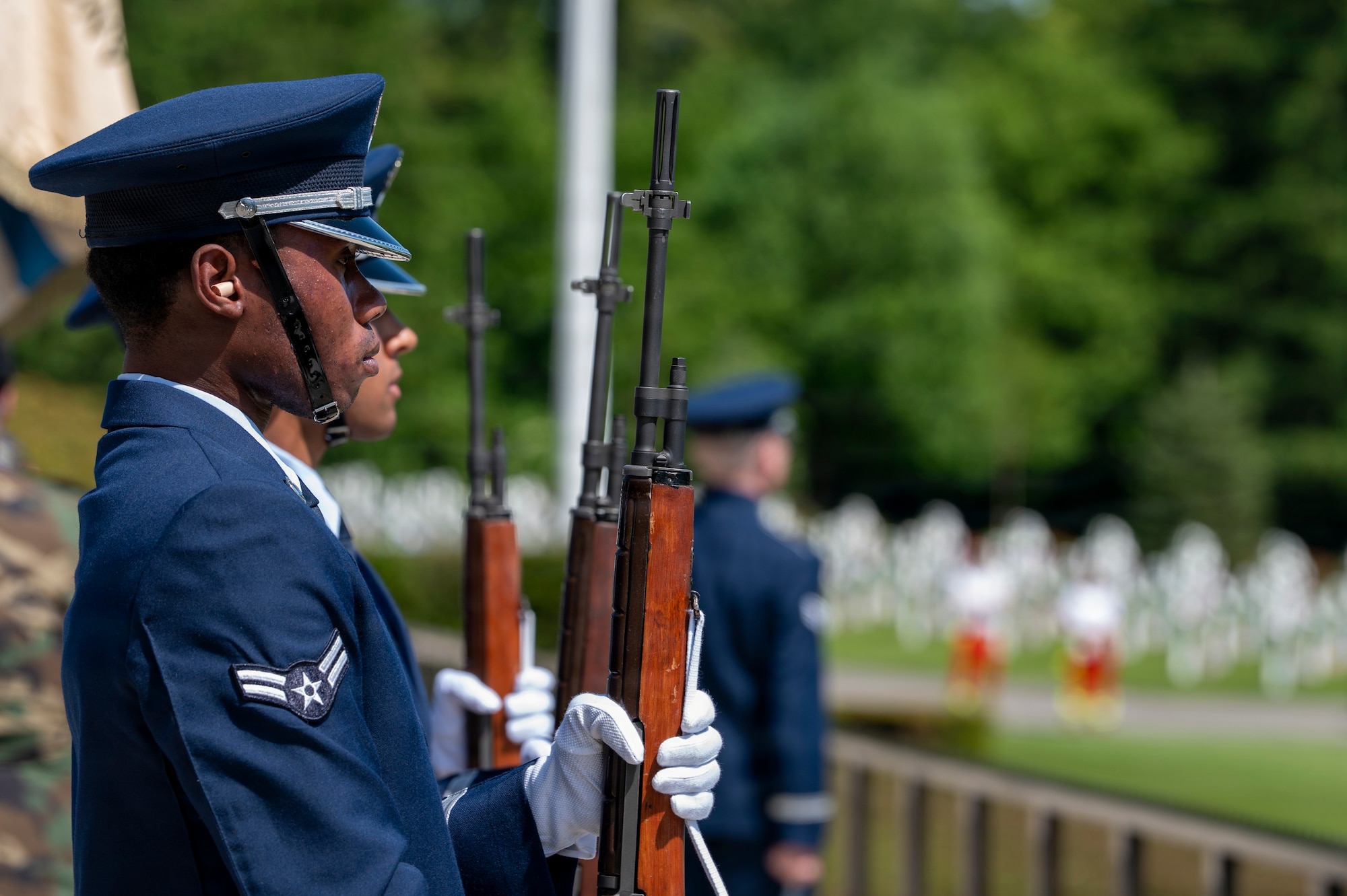 A photo of a Ramstein Air Base Honor Guardsmen holding a rifle during a Memorial Day ceremony at Luxembourg American Cemetery.