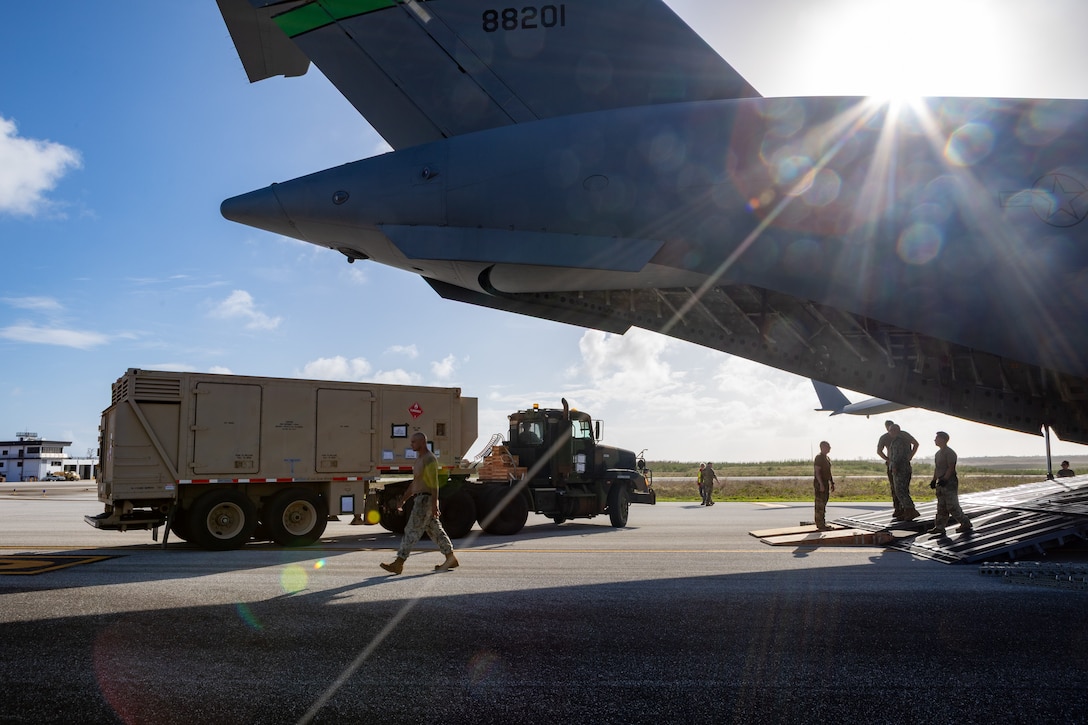 A large electric generator is offloaded from a U.S. Air Force C-17 aircraft