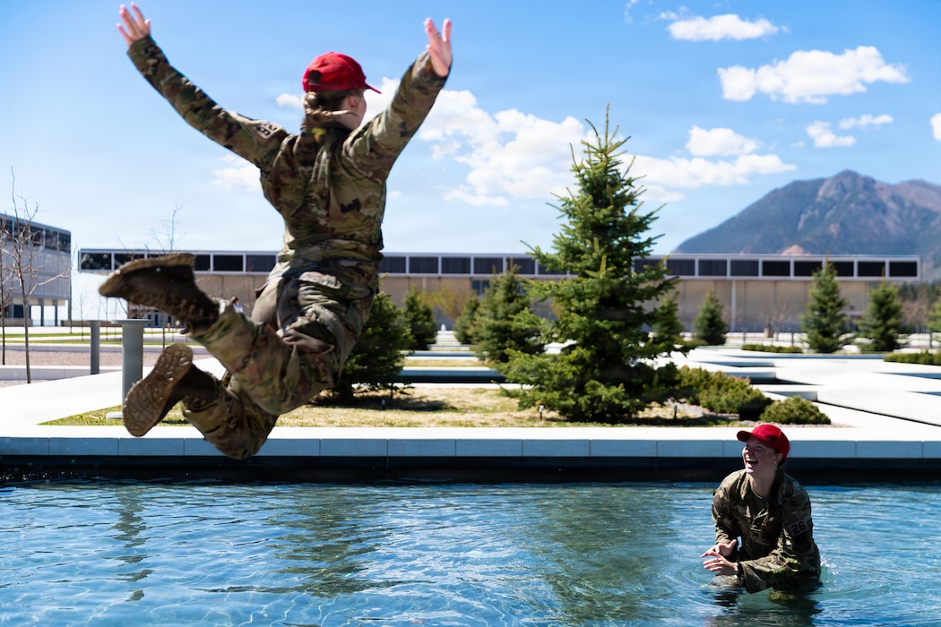 Senior cadets celebrate the completion of final exams by jumping into the Air Garden fountains at the U.S. Air Force Academy, Colo., May 12, 2026. The longstanding tradition, beginning with the first class of graduates in 1959, takes place before graduation each year. (U.S. Air Force photo by Ray Bahner)