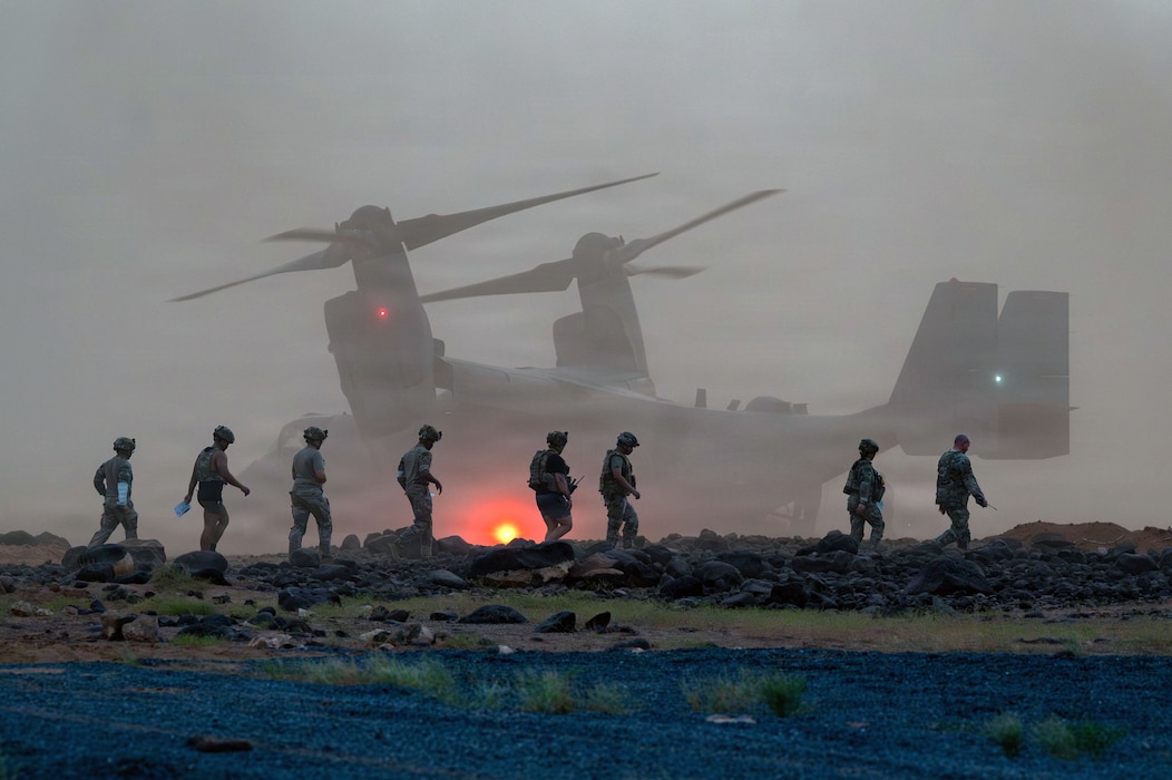 U.S. Air Force Airmen and U.S. Army Soldiers walk toward a U.S. Marine Corps MV-22B Osprey assigned to Marine Medium Tiltrotor Squadron 362 (Reinforced) during a mass-casualty exercise at Chabelley Airfield, Djibouti, April 22, 2026. The exercise tested the capabilities of the Spartan Helicopter Landing Zone and evaluated rapid patient movement procedures in a contingency environment. (U.S. Air Force photo by Senior Airman Abigail Duell)