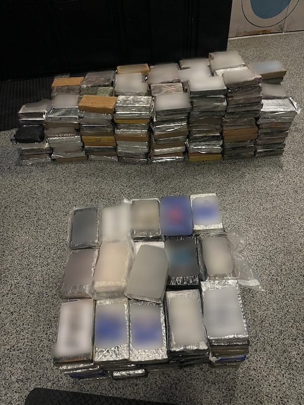 A U.S. Coast Guard Station Miami Beach law enforcement boat crew along with Customs and Border Protection Air and Marine Operations and CBP Office of Field Operations officers seize approximately 900 pounds of cocaine from a suspected drug smuggling vessel at Coast Guard Station Miami Beach, May 29, 2026. Coast Guard Station Miami Beach's crew interdicted the suspected drug smuggling vessel one mile east of Cape Florida, with approximately $6.7 million worth of cocaine. (U.S. Coast Guard photo by Petty Officer 2nd Class Eric Rodriguez)