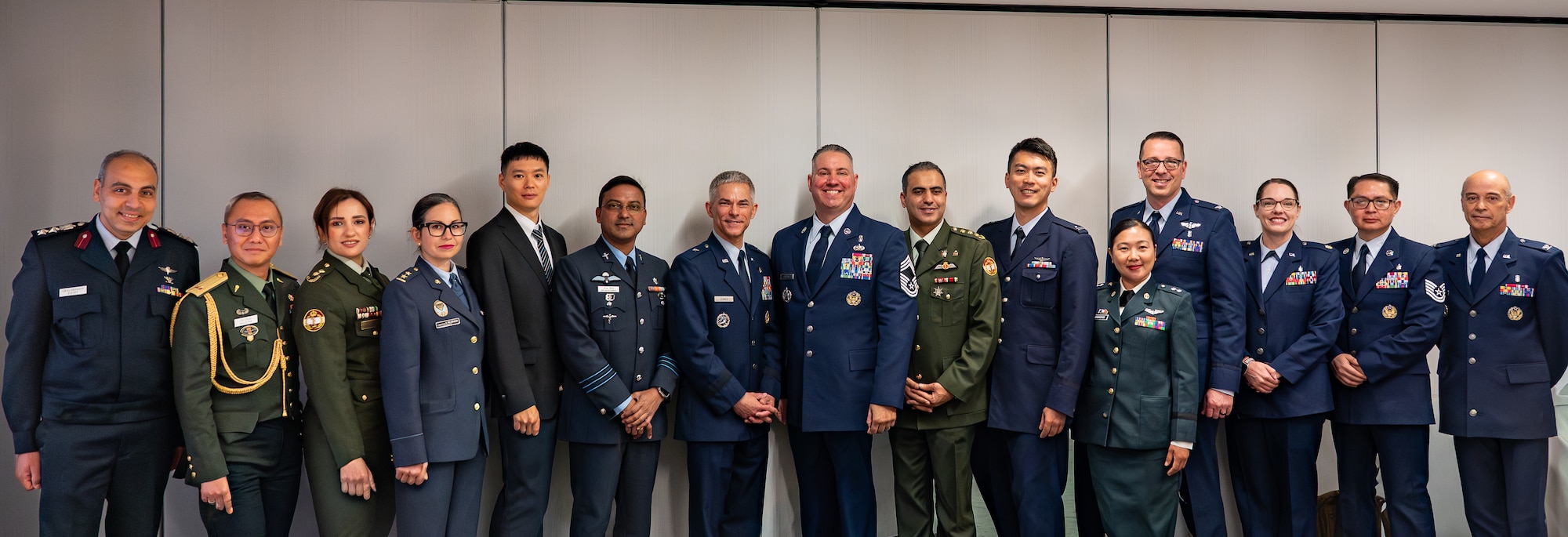 Image of service members posing for a photo.
