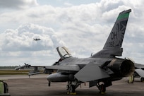 A U.S. Air Force F-16 Fighting Falcon assigned to the Ohio National Guard’s 180th Fighter Wing sits on the flight line as an F-35 Lightning II assigned to the 325th Fighter Wing takes off during Checkered Flag 26-2 and the Weapons System Evaluation Program-East at Tyndall Air Force Base, Fla., April 29, 2026.