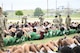Student-athletes from high schools around Central Texas complete sit-ups while arms are interlocked with the people next to them during the Basic Training Challenge at the U.S. Army Experience March 25, 2026, at Fort Hood, Texas.