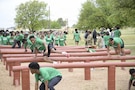 Student-athletes from Ellison High School in Killeen, Texas, jump over and duck under the over-under obstacle during the Basic Training Challenge at the U.S. Army Experience March 25, 2026, at Fort Hood, Texas.