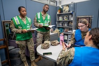 U.S. Air Force members assigned to the 11th Wing Inspection Team observe a member of the 11th Wing Judge Advocate Squadron during a hurricane training event for the emergency family assistance center (EFAC) at Joint Base Anacostia-Bolling, Washington, D.C., on April 14, 2026. The EFAC acted as a disaster-response facility providing crisis counseling, financial aid and logistical support to families. (U.S. Air Force photo by Senior Airman Shanel Toussaint)