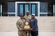 From left, Lt. Gen. Kevin D. Admiral, Commanding General of the III Armored Corps and Fort Hood, Sgt. 1st Class Leroy Betts, and Claude Mathis, head football coach of DeSoto High School pose on the steps of the III Armored Corps headquarters at Fort Hood, Texas
