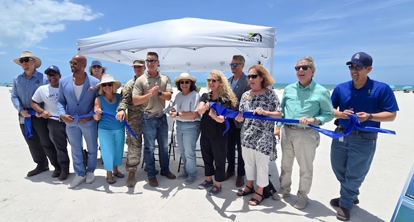 USACE Jacksonville District leadership poses for a photo op with Sarasota City and County officials following a ribbon-cutting celebrating the completion of the renourishment of Lido Key Beach.