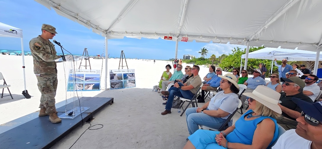 USACE Jacksonville District Deputy Commander for South Florida, Maj. Cory Bell, addresses a crowd of Federal and local elected officials, partners and stakeholders during a ribbon-cutting ceremony celebrating the completion of the USACE’s completed renourishment of Lido Key Beach, using beneficially dredged material from New Pass.