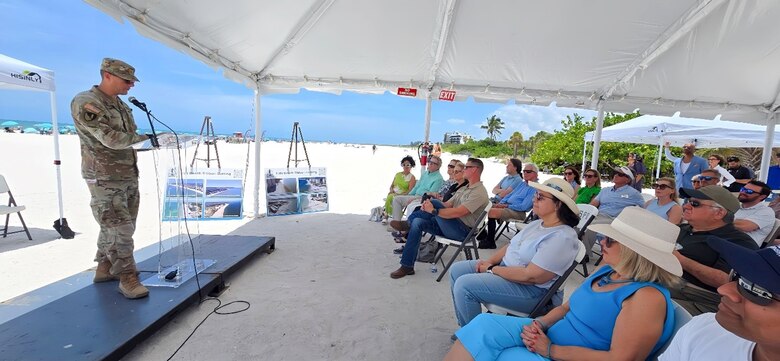 USACE Jacksonville District Deputy Commander for South Florida, Maj. Cory Bell, addresses a crowd of Federal and local elected officials, partners and stakeholders during a ribbon-cutting ceremony celebrating the completion of the USACE’s completed renourishment of Lido Key Beach, using beneficially dredged material from New Pass.