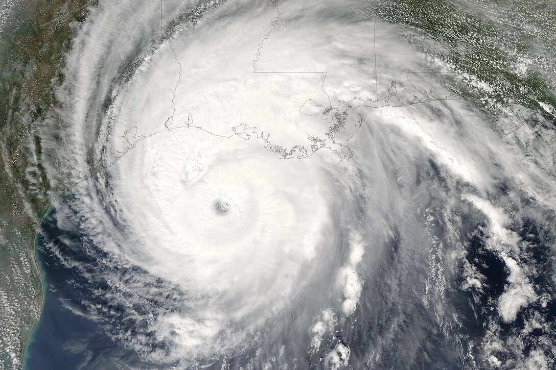 A satellite image of a hurricane reaching the Louisiana coast.