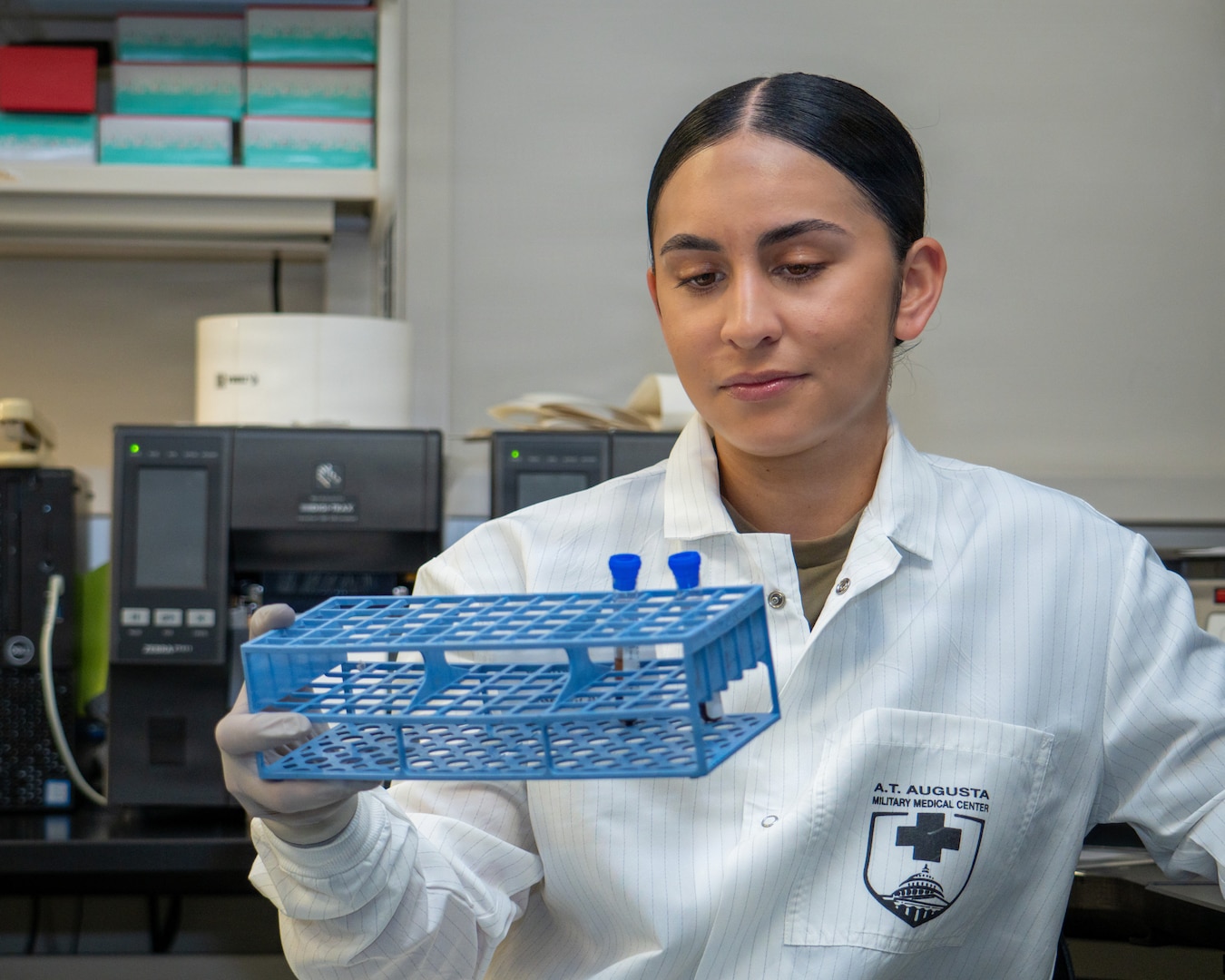 Inside the clinics of the Alexander T. Augusta Military Medical Center (ATAMMC), the Phase II Advanced Individual Training (AIT) program continues to shape the next generation of Army medical professionals. In our ongoing series, “What Does That Red AIT Patch Mean?”, we spotlight Pfc. Caliegh Johnson, a Medical Laboratory Specialist (68K) whose journey reflects perseverance and purpose.