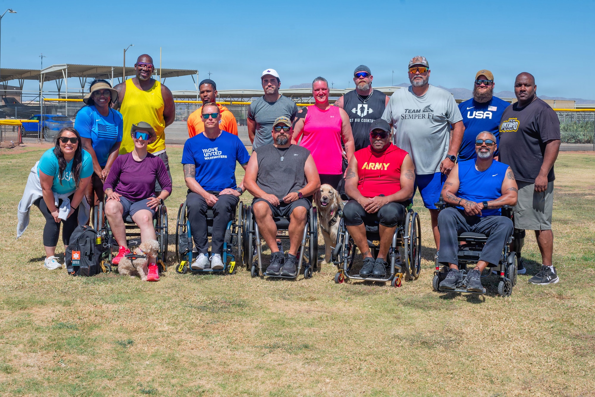 Members of Paralympics Team USA pose for a photo at Luke Air Force Base, Arizona, May 27, 2026. The 56th Force Support Squadron hosted a training event on base to bring together athletes, coaches and staff to promote recovery, teamwork and a culture of resilience through adaptive competition. (U.S. Air Force photo by Airman 1st Class Tekorey Watkins)