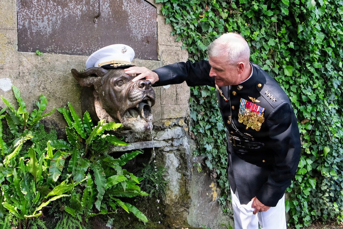 The 38th Assistant Commandant of the Marine Corps, Gen. Bradford J. Gering, prepares to take a drink from the Devil Dog Fountain at the Aisne-Marne American Cemetery, Belleau, France, May 24, 2026. Gering visited Aisne-Marne American Cemetery as the senior United States Marine Corps representative to participate in the 2026 Belleau Wood Memorial Day Ceremony. (U.S. Marine Corps photo by Lance Cpl. Valerie Escobar)