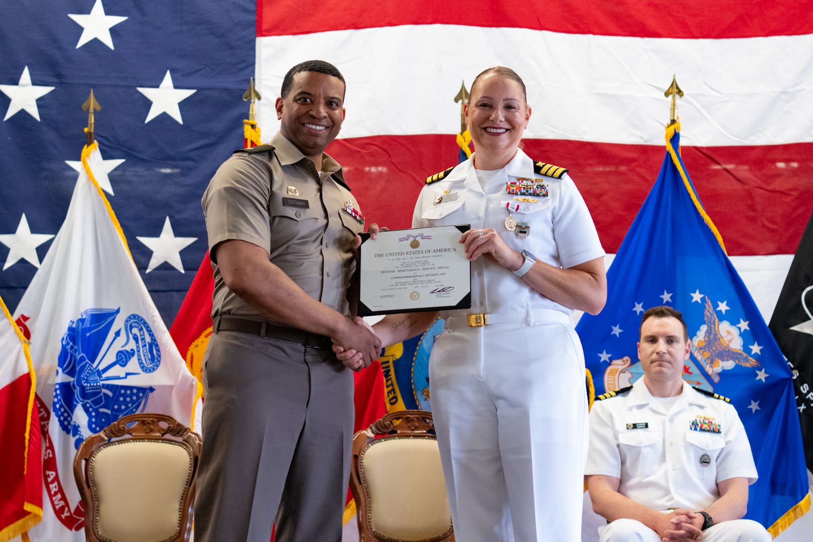 Military officers on stage
