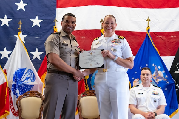 Military officers on stage