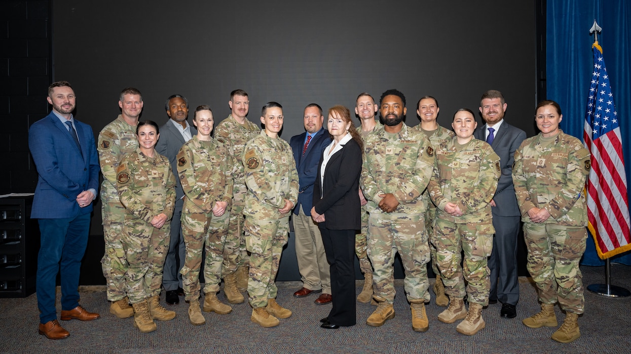 A group photo of military and civilian personnel