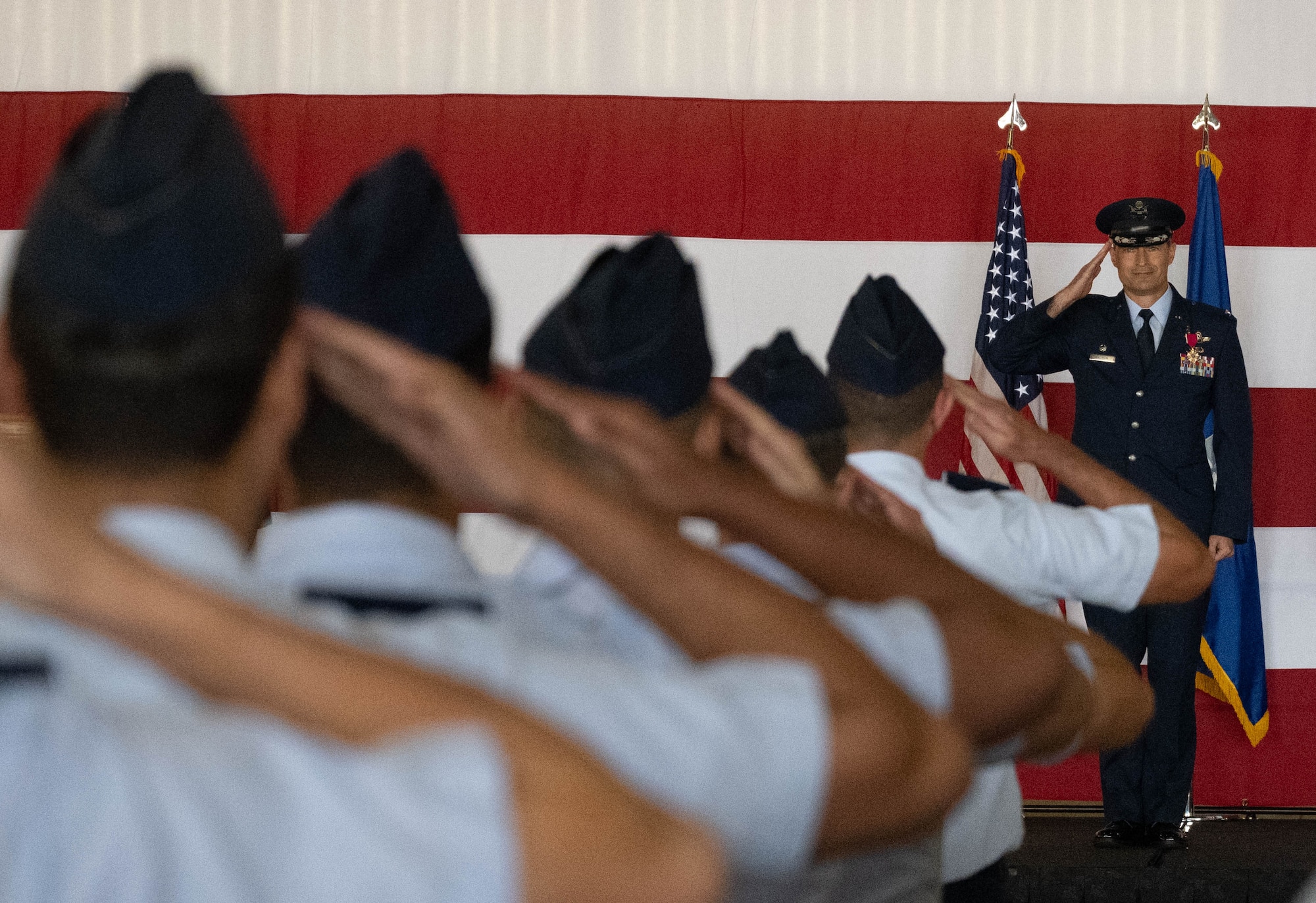 U.S. Air Force Col. Tyler Ellison, outgoing 47th Flying Training Wing commander, gives a final salute to his unit during the 47th FTW change of command ceremony at Laughlin Air Force Base, Texas, May 28, 2026. As commander, Ellison oversaw the execution of more than 71,000 aircraft sorties and graduating over 700 student pilots from Undergraduate Pilot Training. (U.S. Air Force photo by Airman 1st Class Darryl Keith)