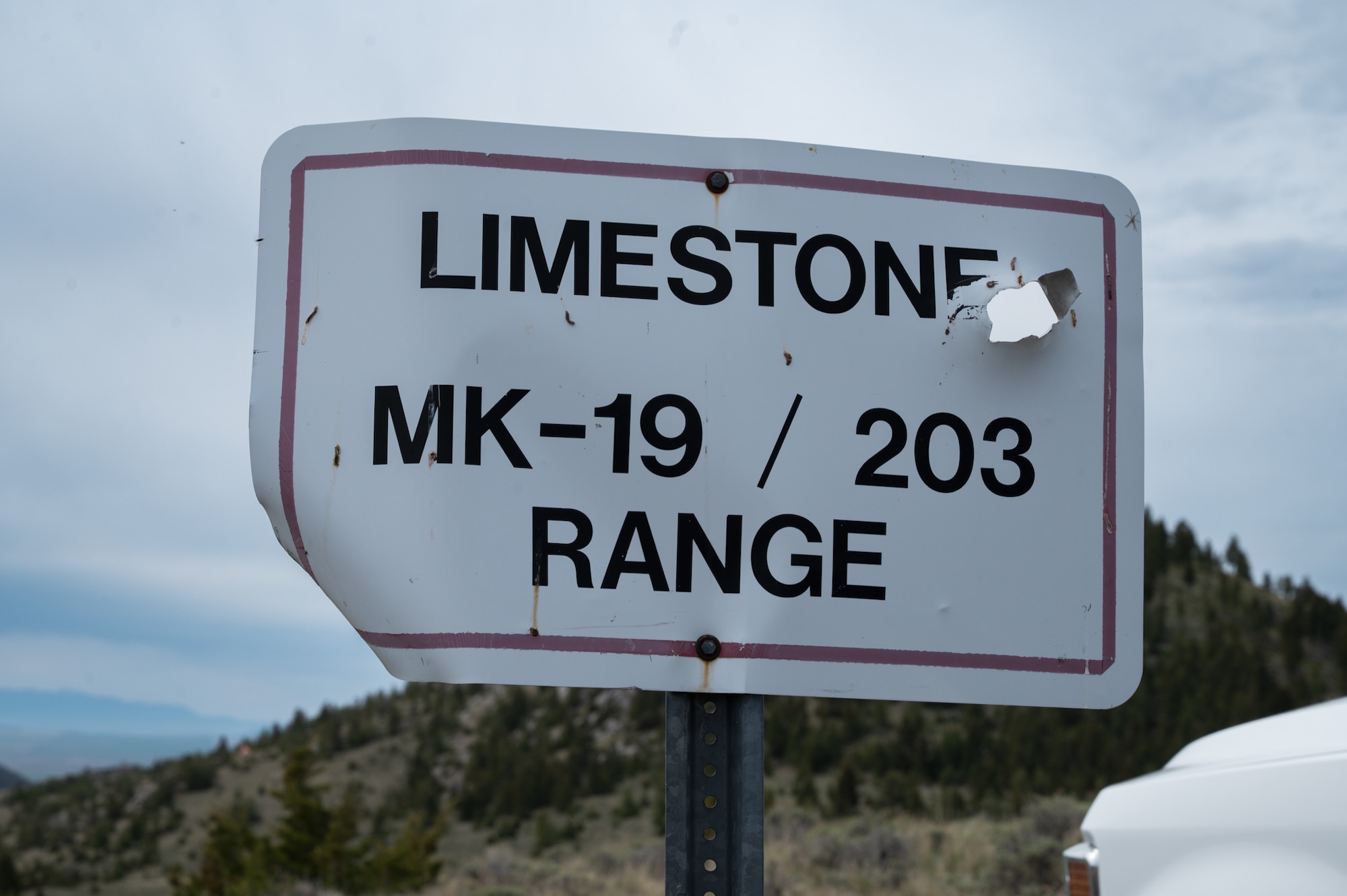 A range sign designates the active live-fire training area used during Mk 19 grenade launcher qualification training.