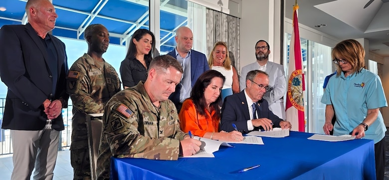 U.S. Army Corps of Engineers, Jacksonville District Commander Col. Brandon Bowman, with Assistant Secretary of the Army for Civil Works, Adam Telle and Deputy Commanding General for Civil and Emergency Operations, Maj. Gen. Jason Kelly conducts the signing of a Project Cooperation Agreement Amendment with Pinellas County, resolving longstanding implementation issues involving easement requirements and public access provisions that have created uncertainty surrounding future nourishment cycles.